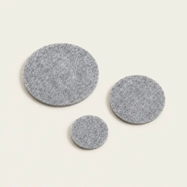 Three sizes of round gray Feltease furniture felt pads
